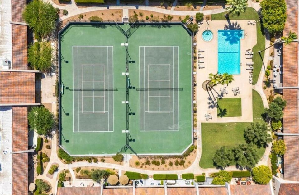 Aerial view of the resort-style tennis and pickleball courts and pool