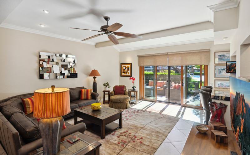 Sunken living room with leather sofas and patio doors