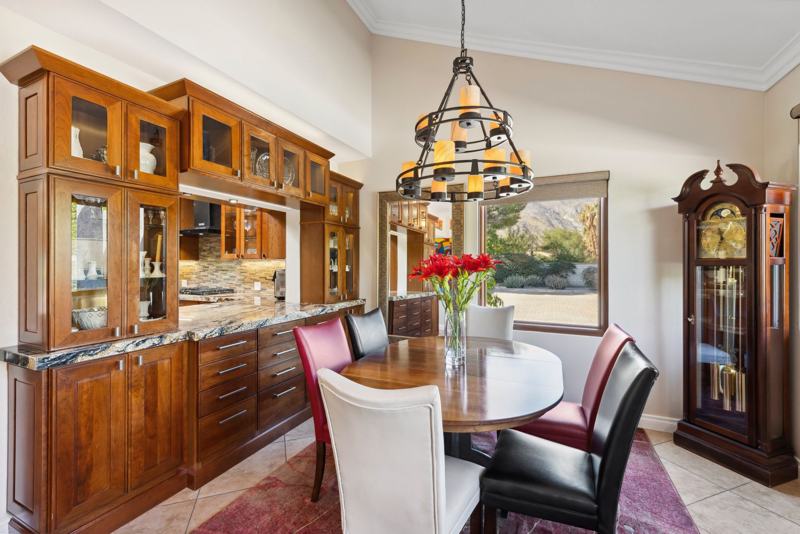Formal dining room with cathedral ceilings and mountain views