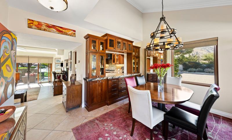 Formal dining room with cathedral ceilings and extensive formal dinnerware