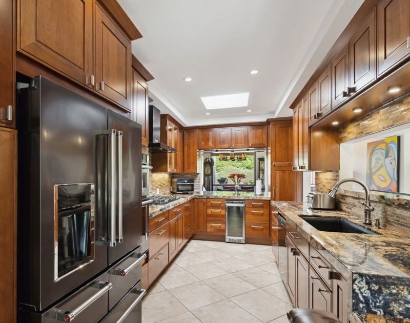 Gourmet chef's kitchen with granite counters and stainless appliances