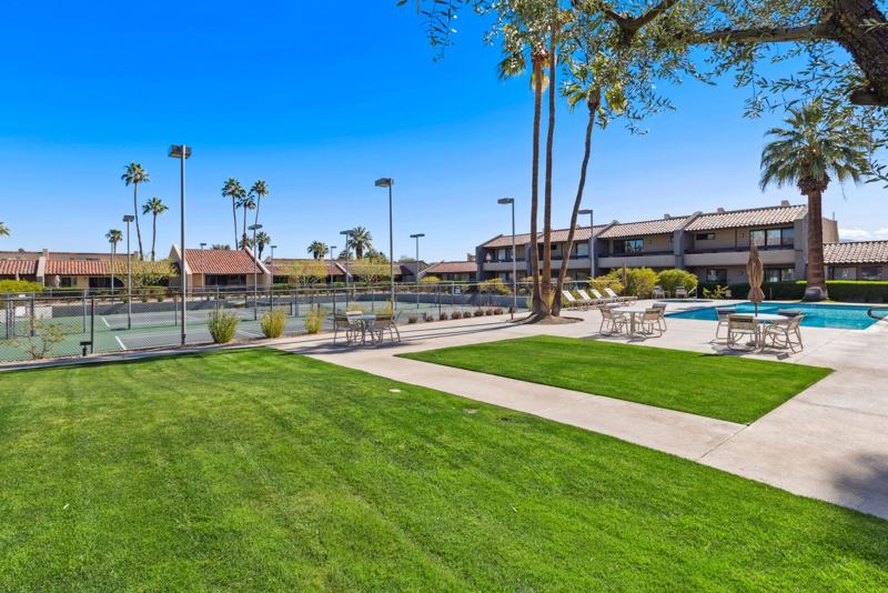 Resort-style courtyard with lush desert landscaping
